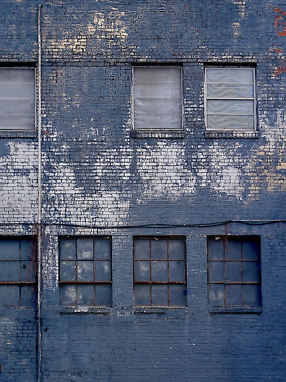 Paper Print Windows on a Blue Brick Wall